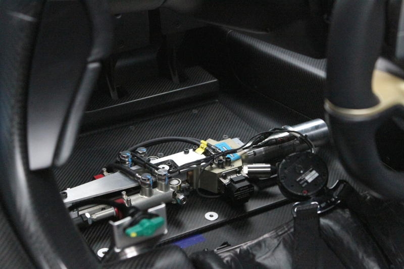 Brake actuators for the autonomous drive in the driver-side floorboard that won’t make it into the production EP9. Photo credit: Stef Schrader